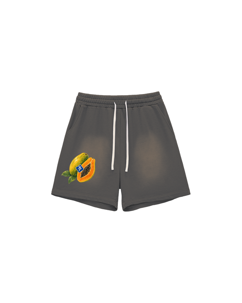 Sun-faded grey shorts with white drawstring; a whole and cut papaya with black seeds sits low on the left thigh.